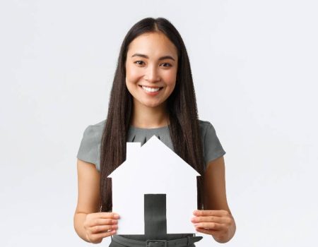 woman-holding-paper-house
